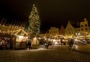 Christmas market around fir tree in Tallinn, Estonia