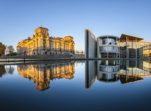 Reichstag with reflection in river Spree, Berlin